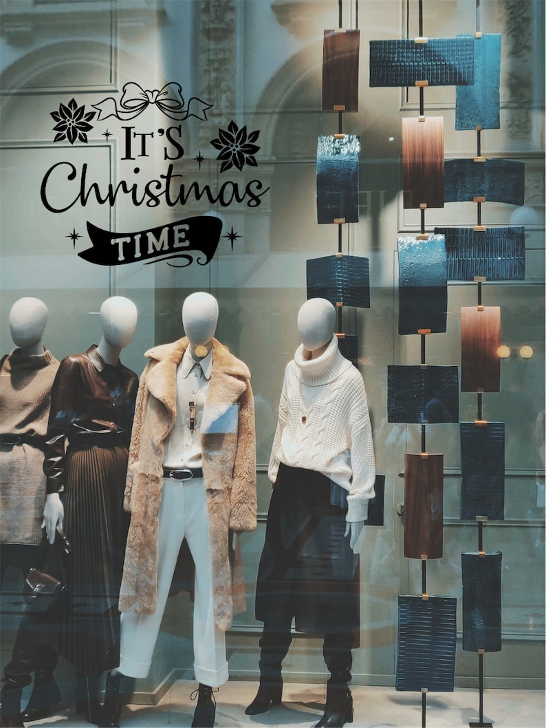 It's Christmas Time vinyl window decal in a Christmas retail display
