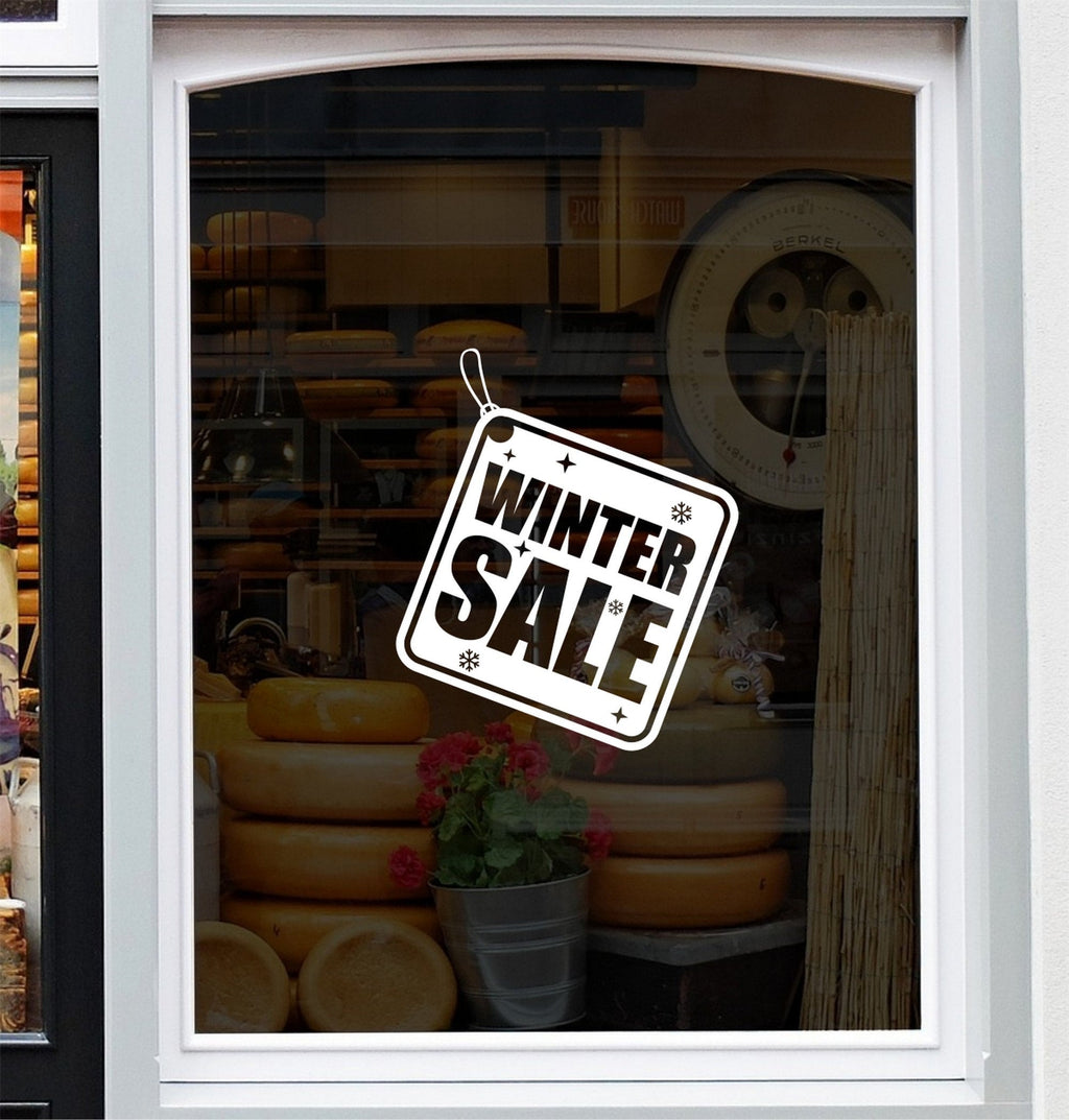 Winter Sale Shop Window Sticker shown in a shop window display