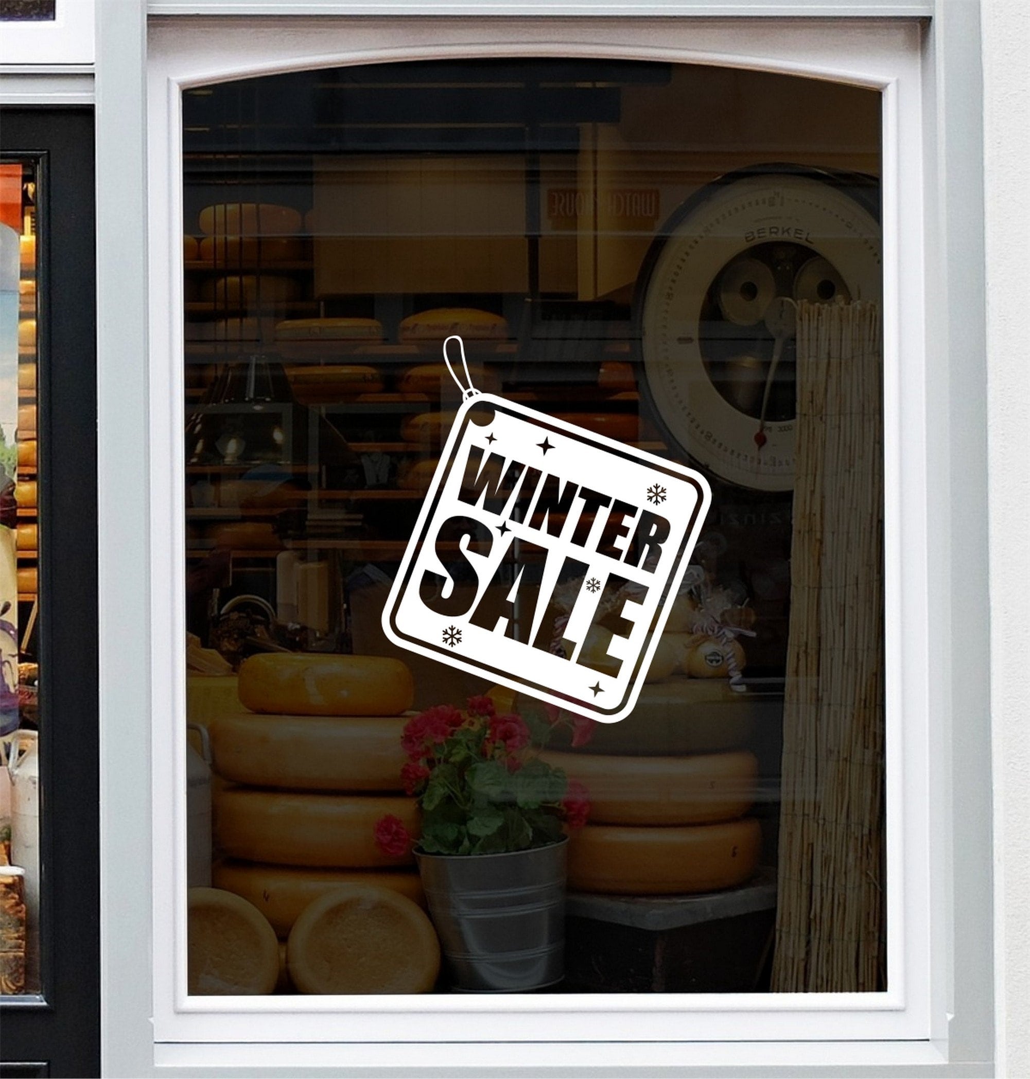 Winter Sale Shop Window Sticker shown in a shop window display