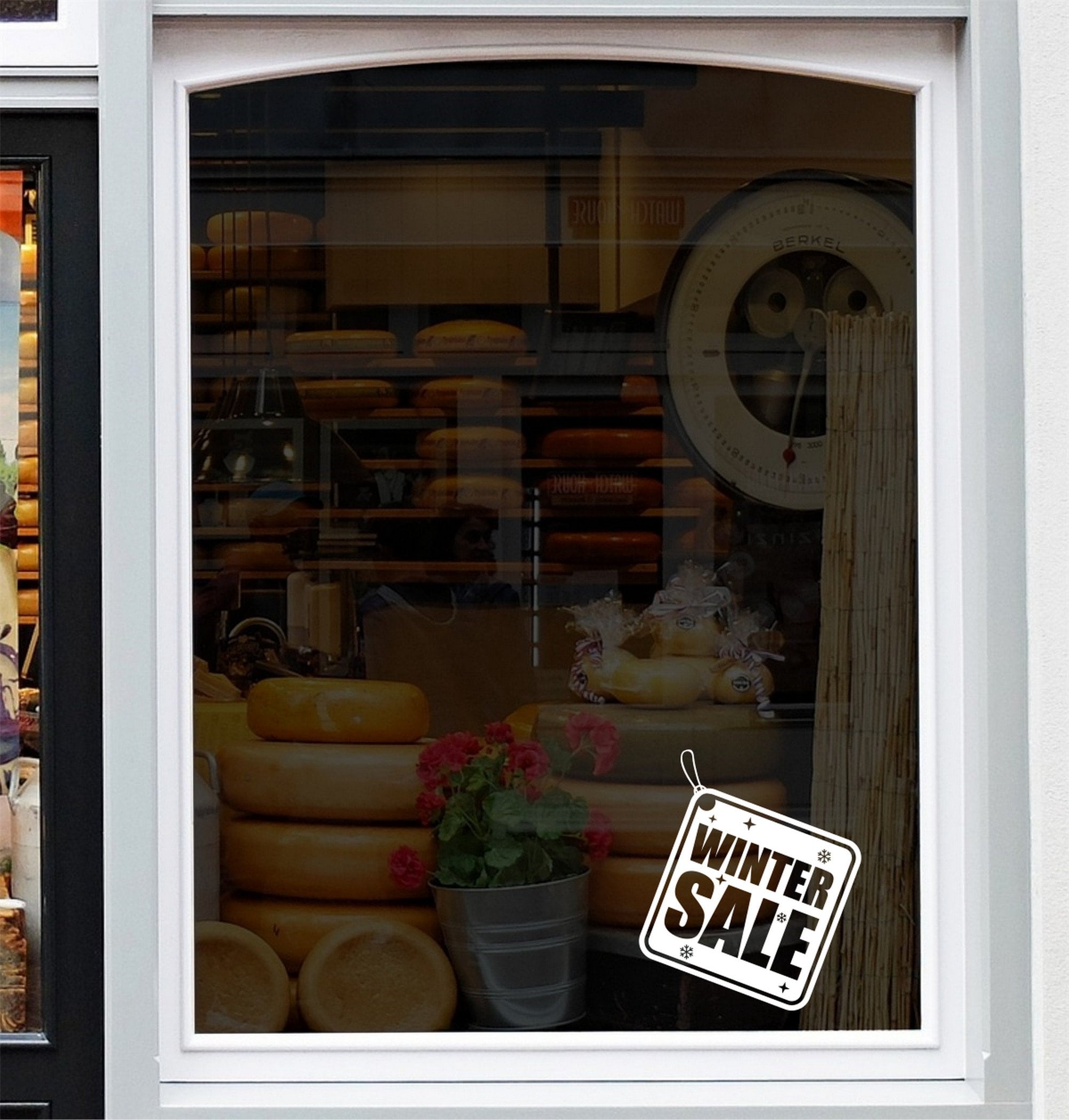 Winter Sale Shop Window Sticker displayed on a storefront glass pane