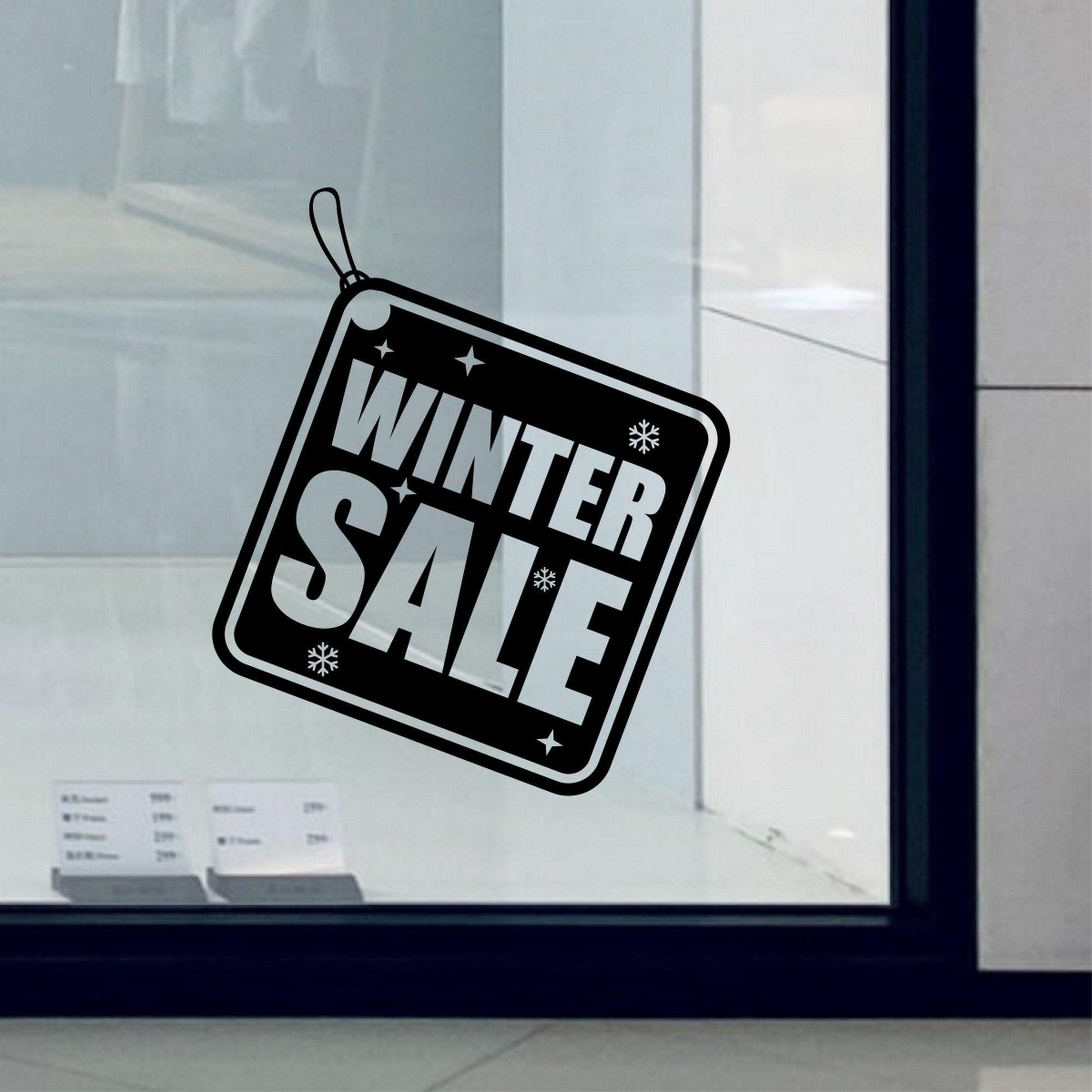 Winter Sale Shop Window Sticker shown in an alternative retail window setting