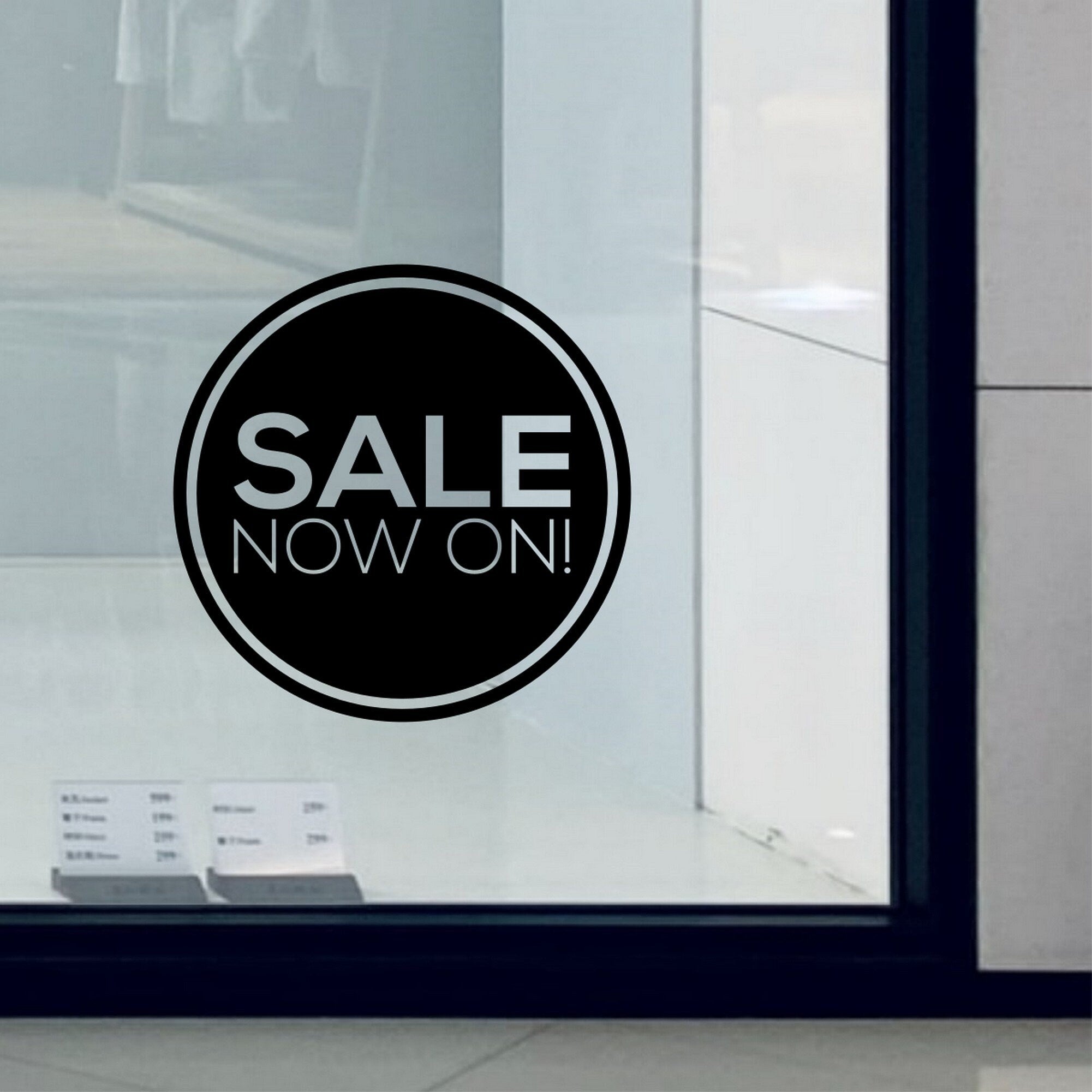 Sale Now On Shop Window Sticker shown in a shop window display
