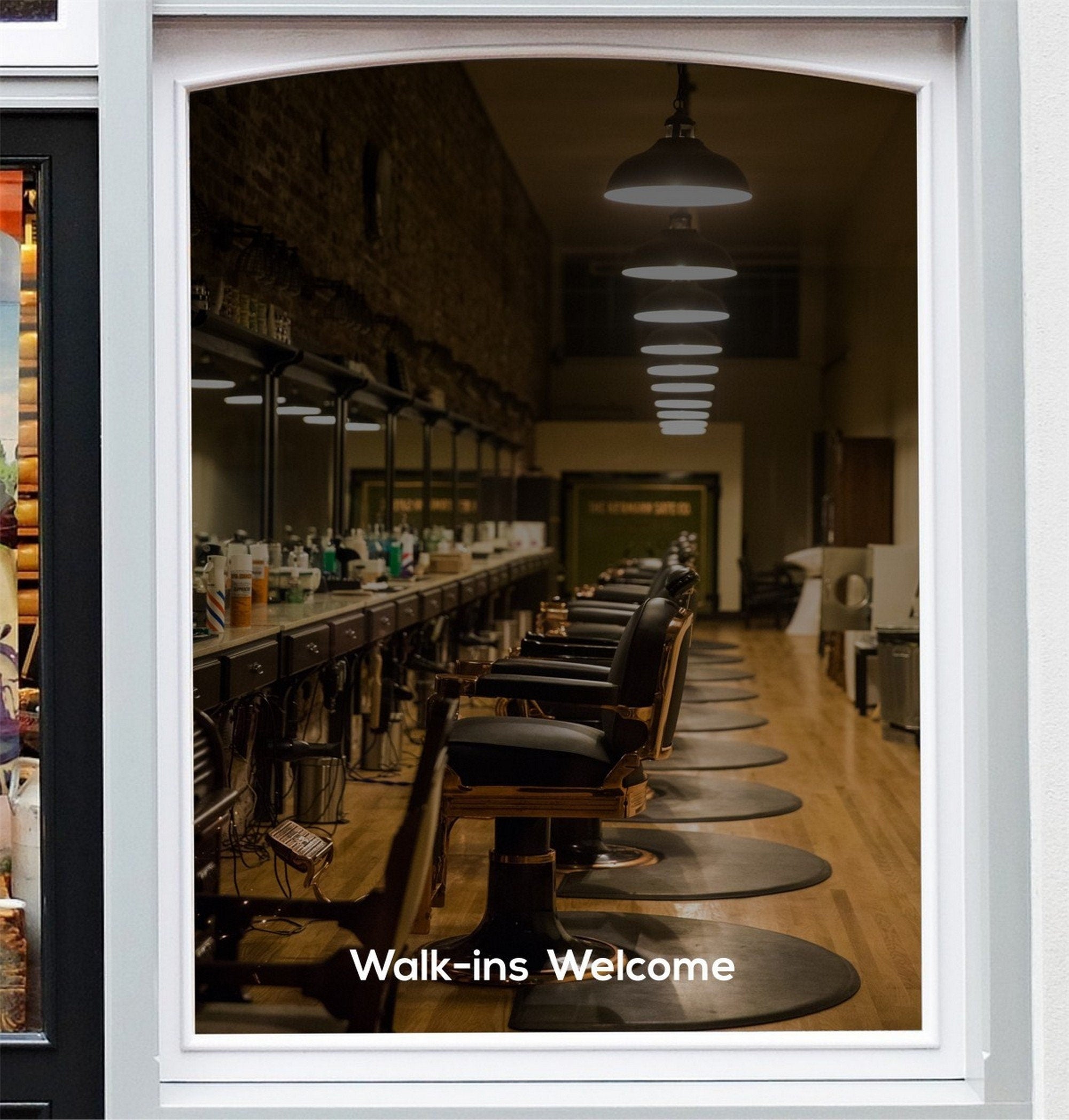 Walk-Ins Welcome Window Sticker for Salons & Barbers shown in a shop window display