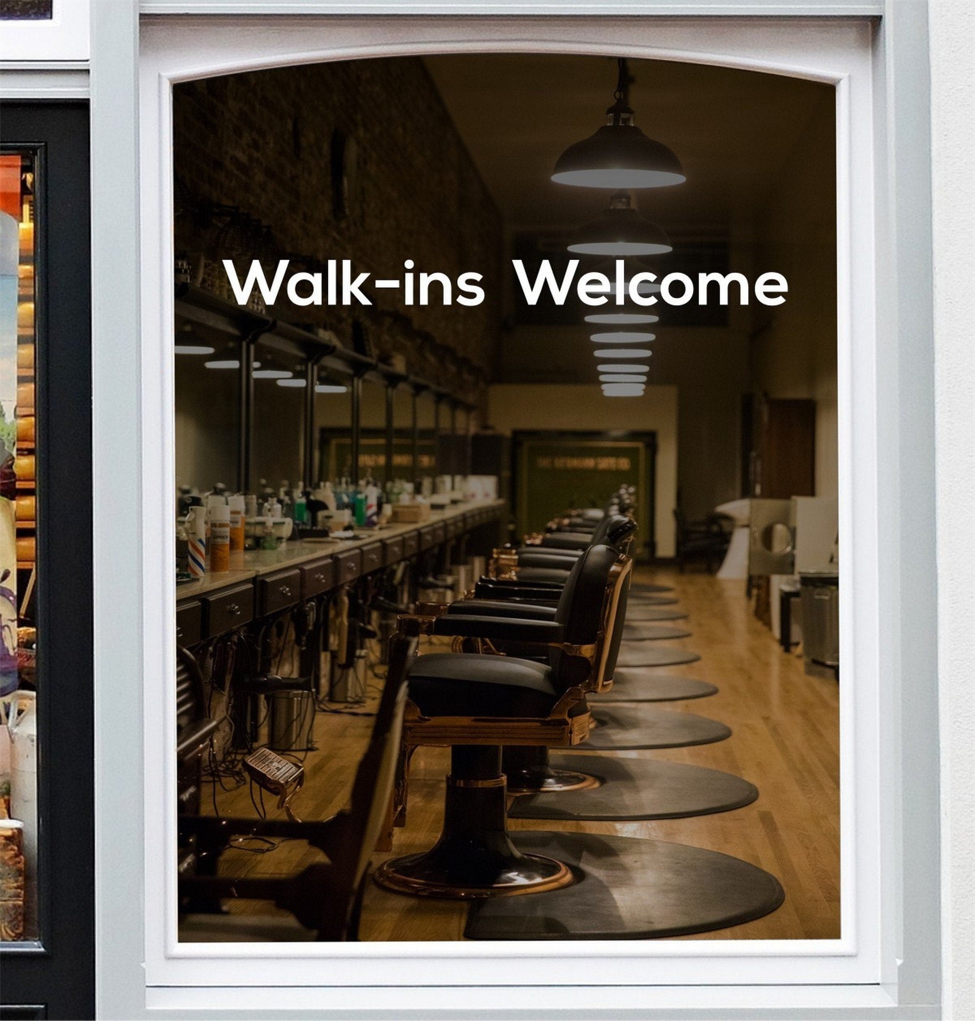 Walk-Ins Welcome Window Sticker for Salons & Barbers displayed on a storefront glass pane