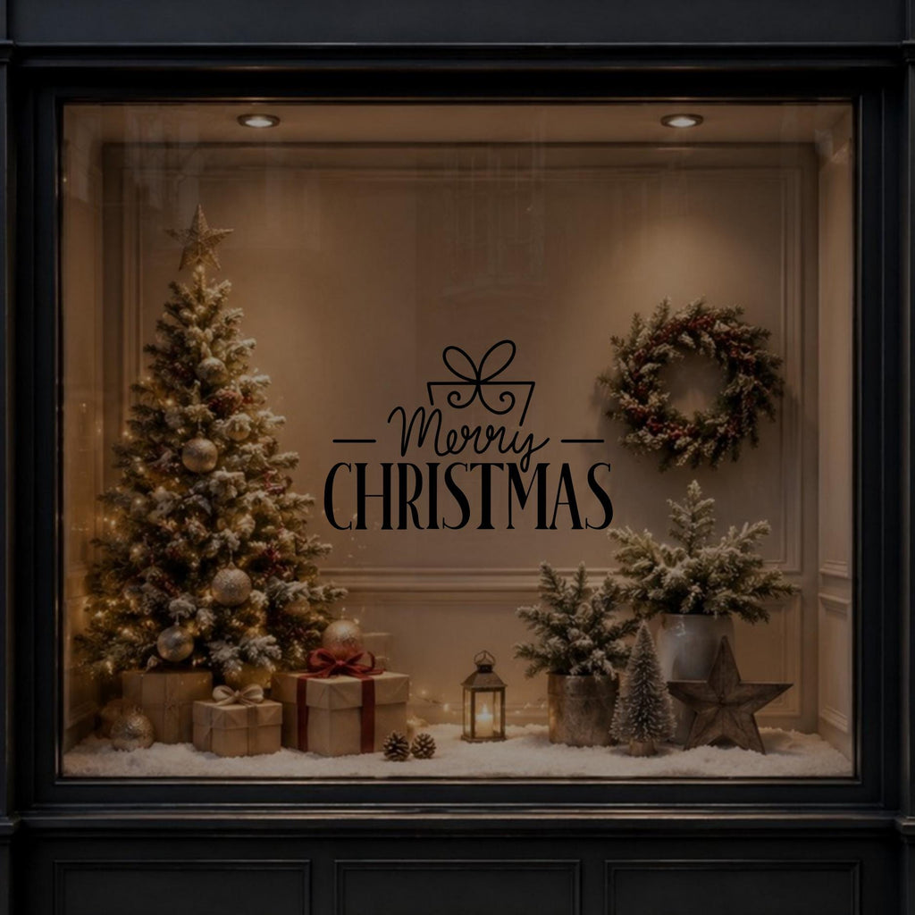 Black Merry Christmas ribbon bow vinyl decal shown on a festive window display