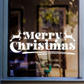 Elegant Merry Christmas window decal displayed on a modern Christmas-themed window with warm festive decorations and soft lighting.