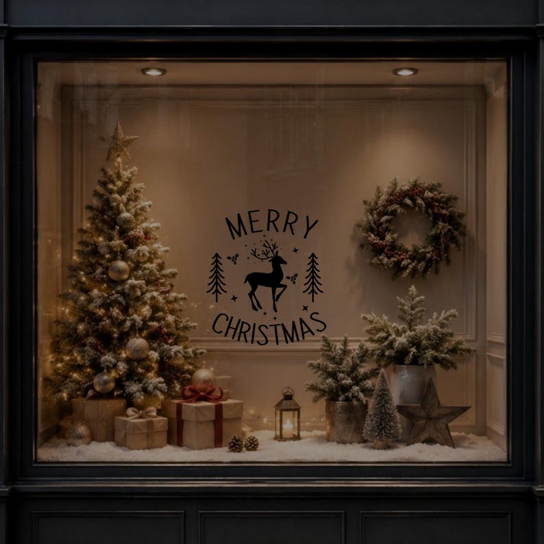 Festive reindeer and fir tree Merry Christmas vinyl sticker displayed on a dark glass window in a Christmas setting.