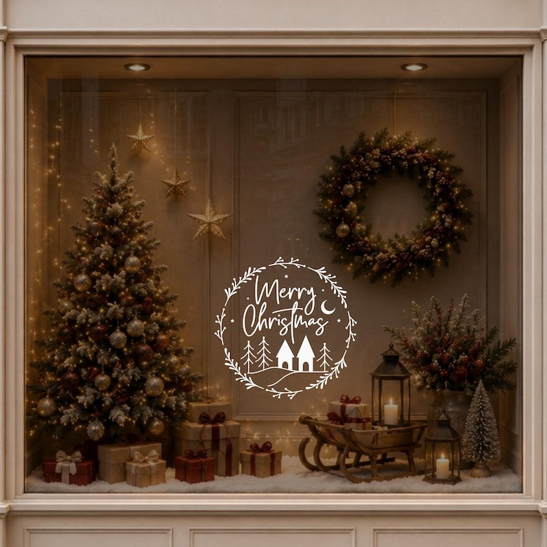 Merry Christmas wreath decal displayed on a window beside a decorated Christmas tree and warm festive decorations.