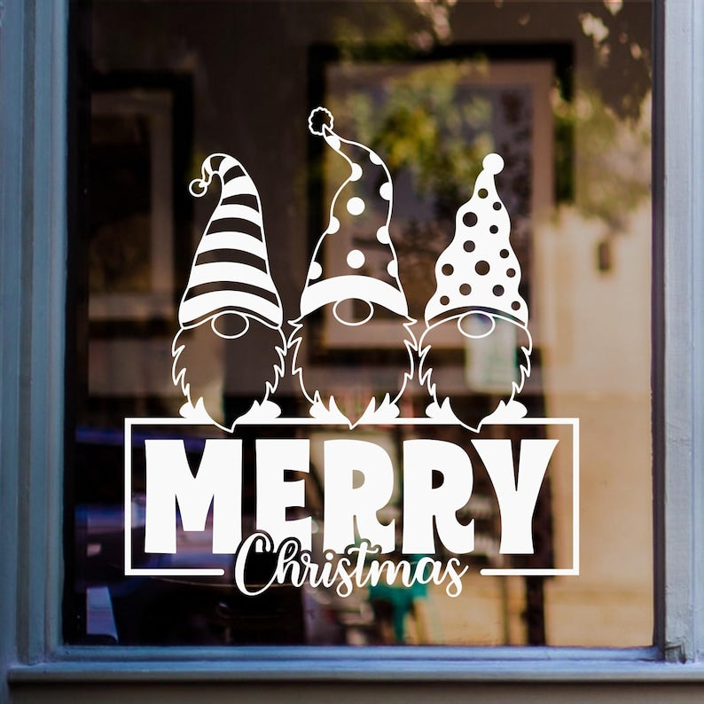 White Merry Christmas gnome window sticker featuring three festive gnomes with patterned Christmas hats displayed on glass.