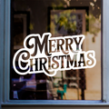 Bold Merry Christmas window sticker displayed in white vinyl on a home window.