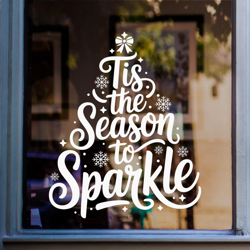 Tis the Season to Sparkle Christmas tree window sticker displayed in white vinyl on glass.
