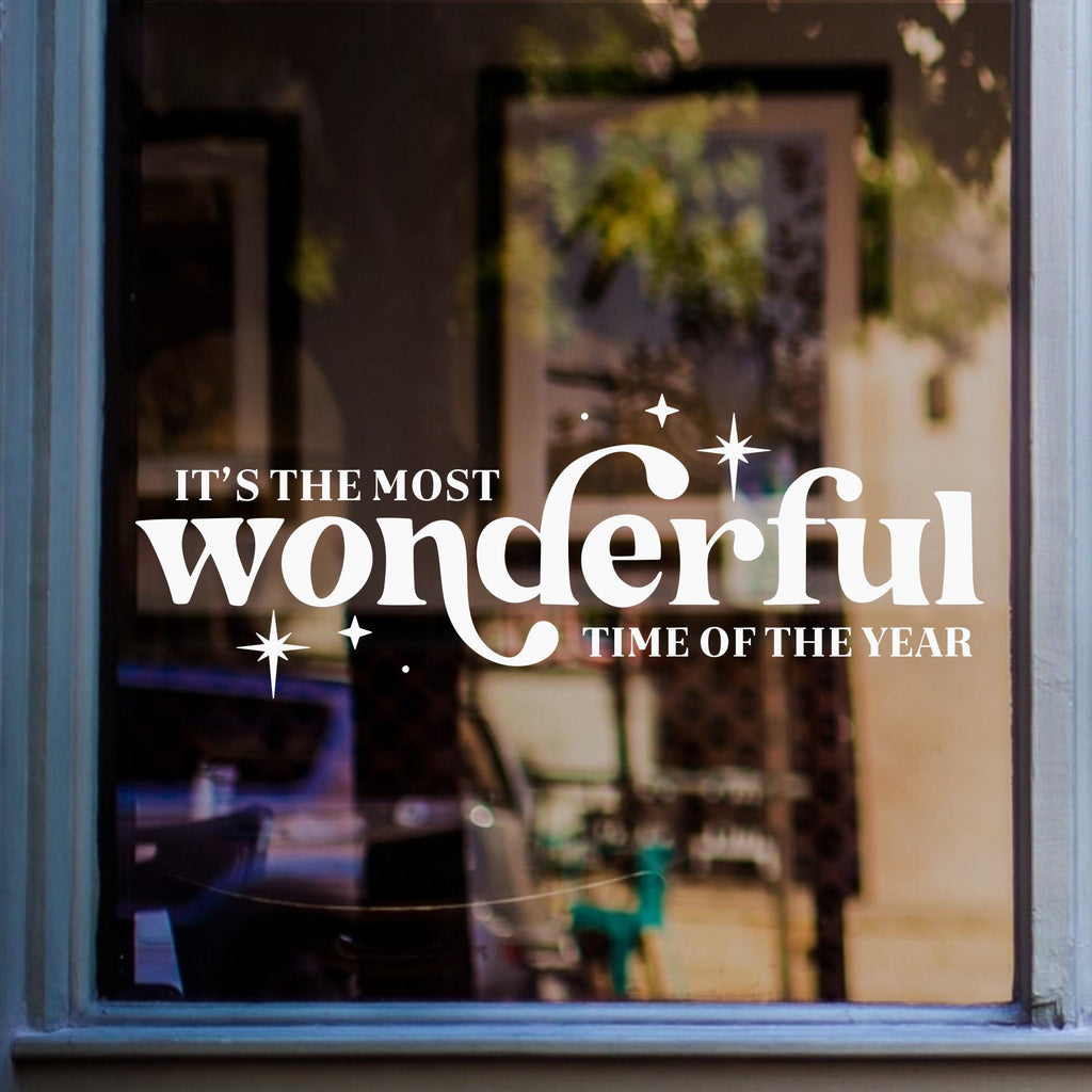 Wonderful Time of the Year Christmas window sticker displayed in white vinyl on glass.