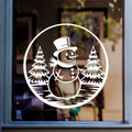 Christmas snowman window sticker featuring snowy fir trees in a circular winter scene displayed on glass.