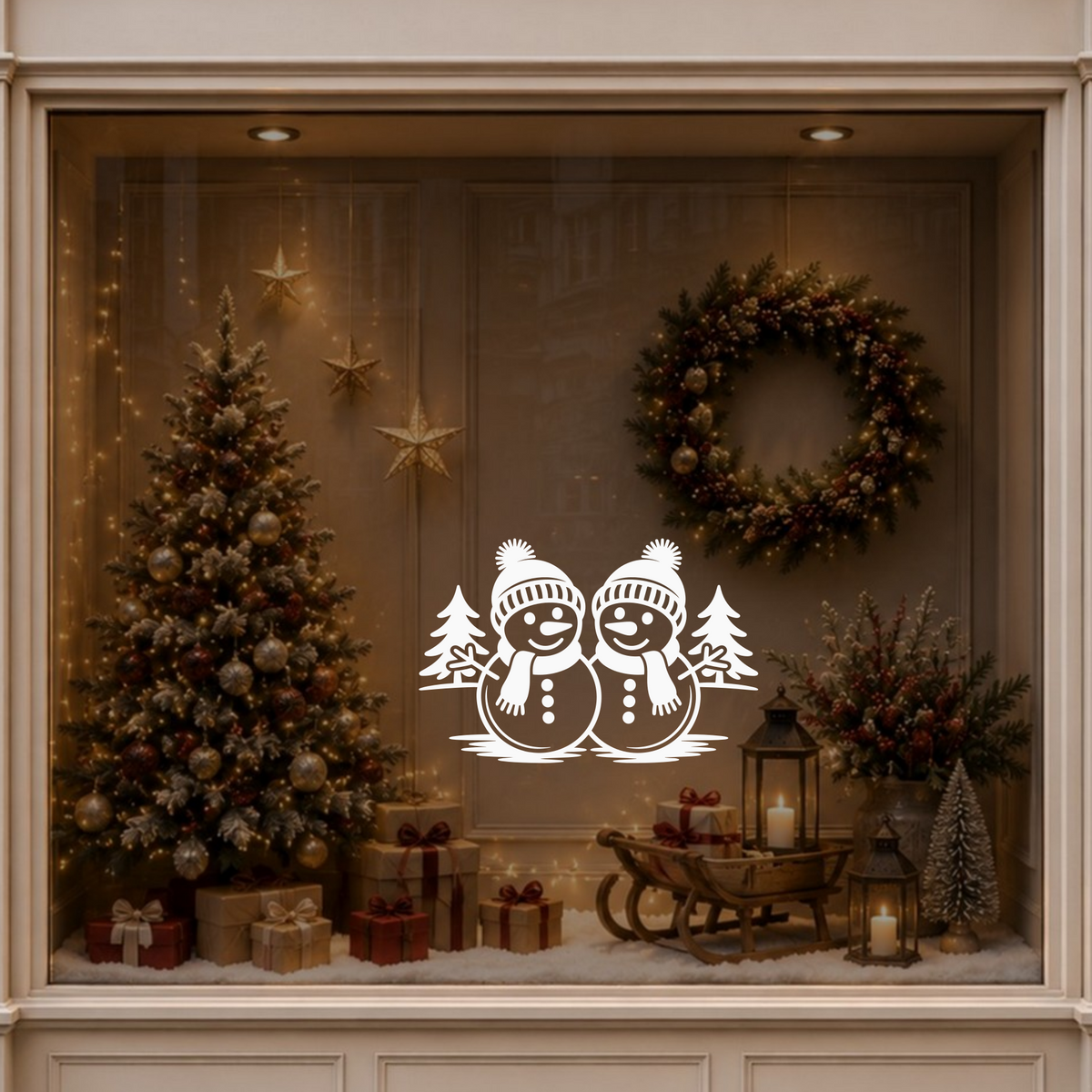 Christmas snowmen window decal displayed on a warmly decorated festive shop window.