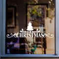 Merry Christmas window sticker with Christmas tree and decorative flourishes displayed on glass.