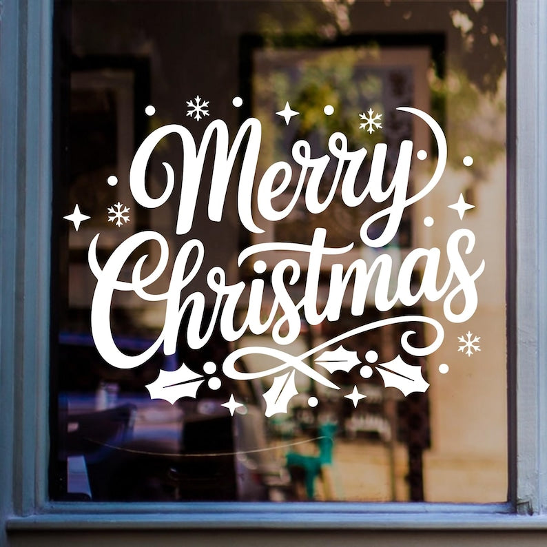 Merry Christmas window sticker featuring bold script lettering and festive stars displayed on glass