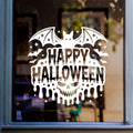 Halloween Skull & Large Bat Window Sticker: white vinyl design on a blue-framed glass door