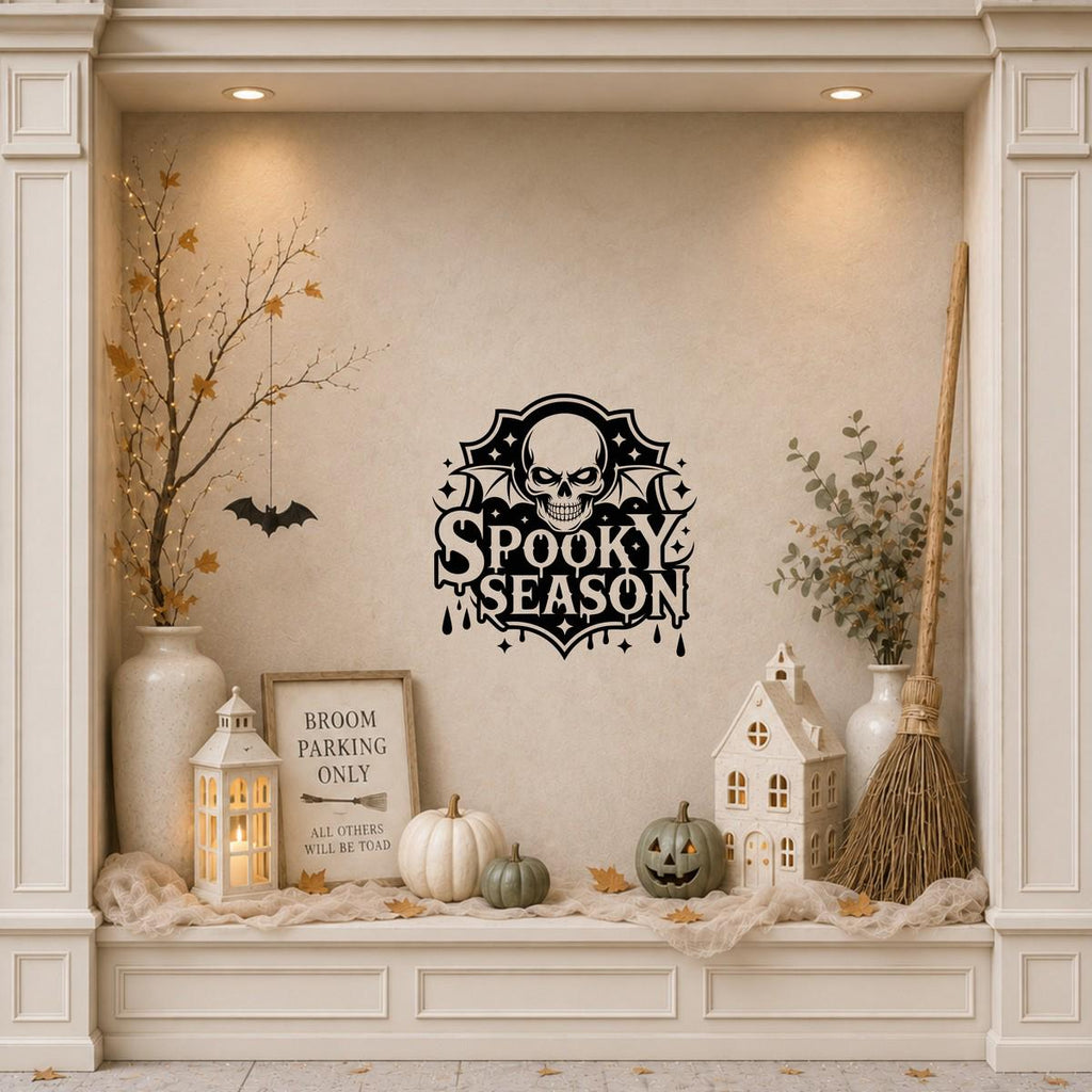 Spooky Season Skull & Bat Wings Window Sticker: black vinyl displayed in a cream shopfront window