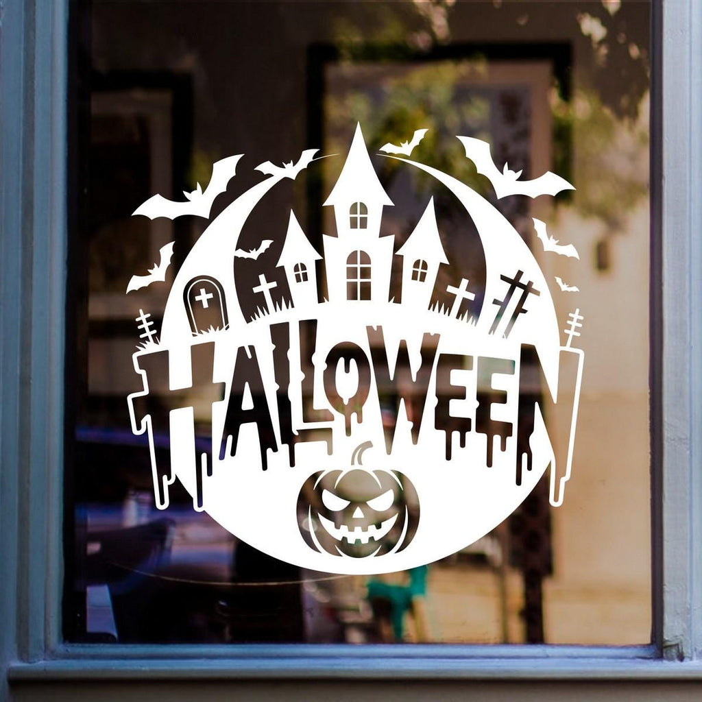 Haunted House & Graveyard Halloween Window Sticker: white vinyl design on a blue-framed glass door