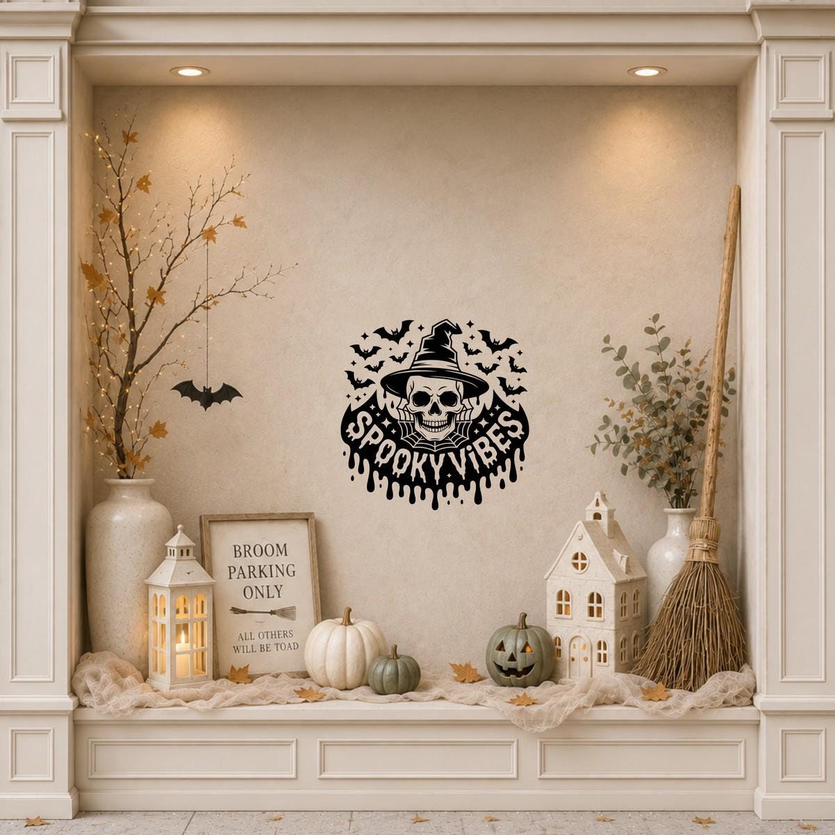 Spooky Vibes Witch Skull & Bat Swarm Window Sticker: black vinyl displayed in a cream shopfront window