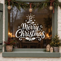 Merry Christmas Tree Window Sticker in white on a sage green framed window decorated for Christmas