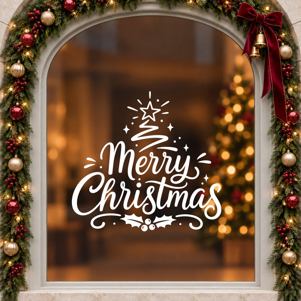 Merry Christmas Tree Window Sticker in white on an arched cream window with a Christmas garland and red bow