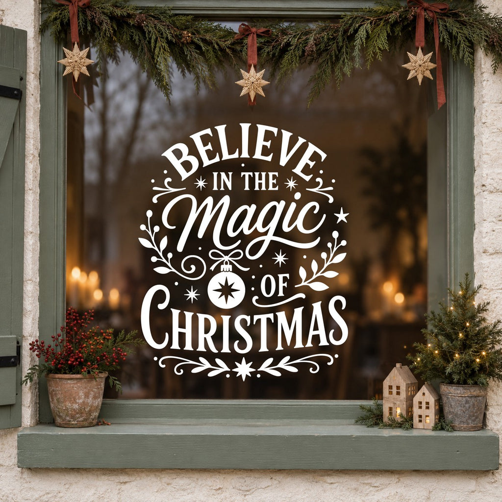 Believe in the Magic of Christmas Window Sticker in white on a sage green framed window decorated for Christmas