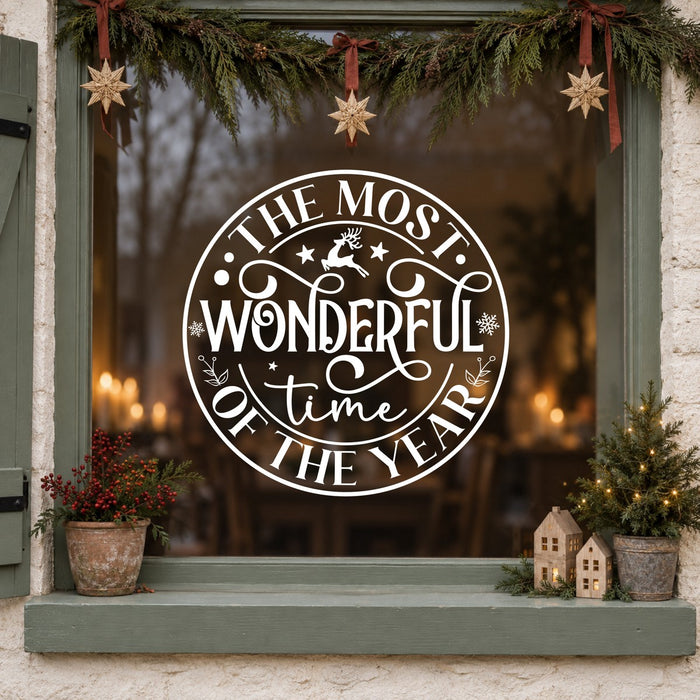 Round Most Wonderful Time of the Year Window Sticker in white on a sage green framed window decorated for Christmas