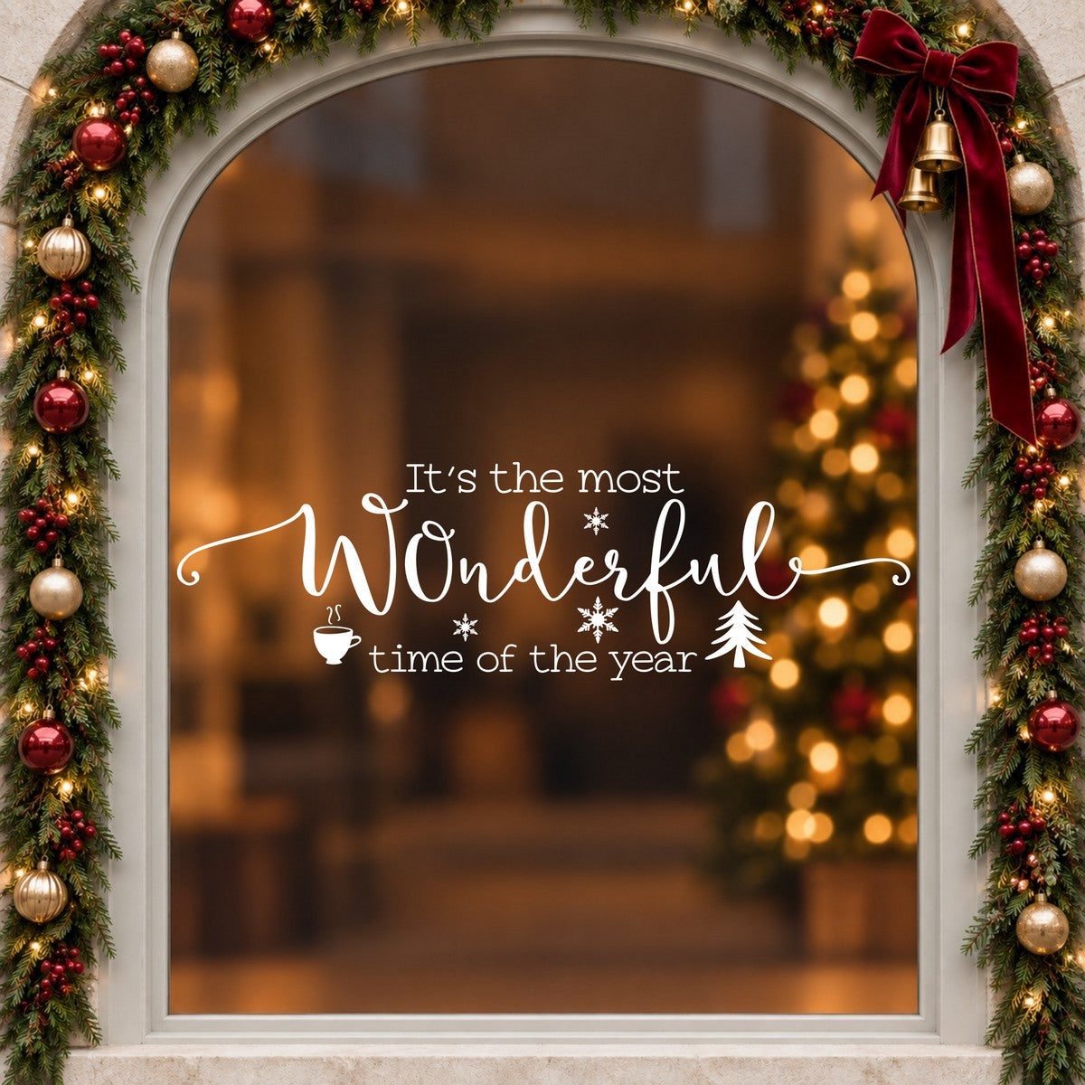 Wonderful Time of the Year Christmas Window Sticker in white on an arched cream window with a Christmas garland and red bow