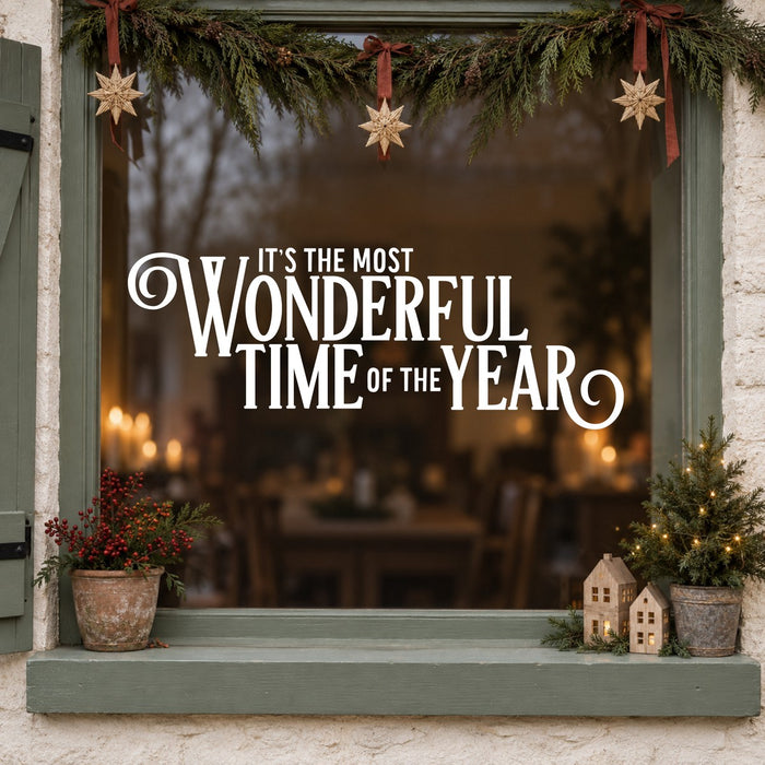 Most Wonderful Time of the Year Christmas Window Sticker in white on a sage green framed window decorated for Christmas