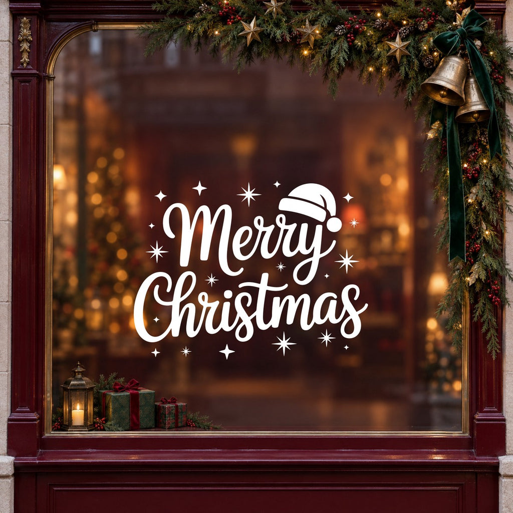 Merry Christmas Santa Hat Window Sticker in white on a burgundy shop window with festive greenery, bells and gifts