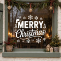 Merry Christmas Snowflake Window Sticker in white on a sage green framed window decorated for Christmas