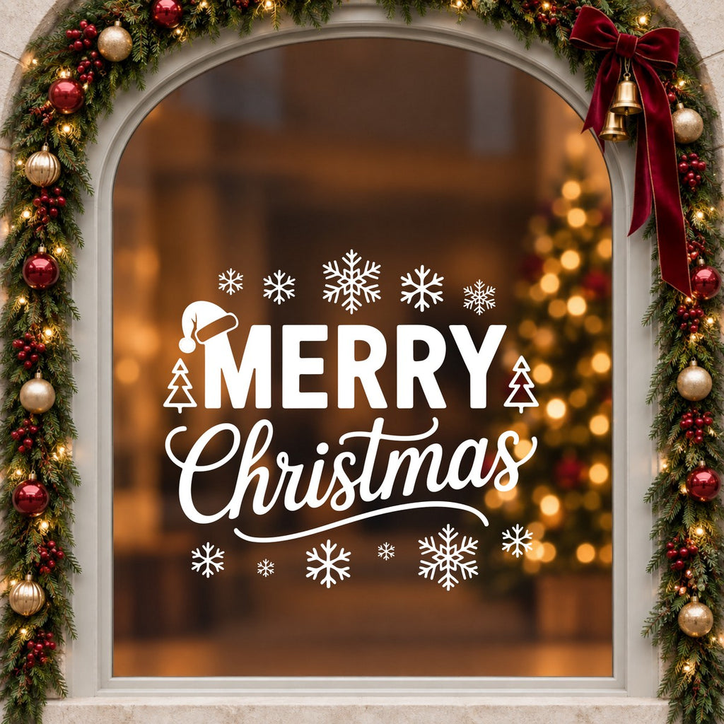 Merry Christmas Snowflake Window Sticker in white on an arched cream window with a Christmas garland and red bow