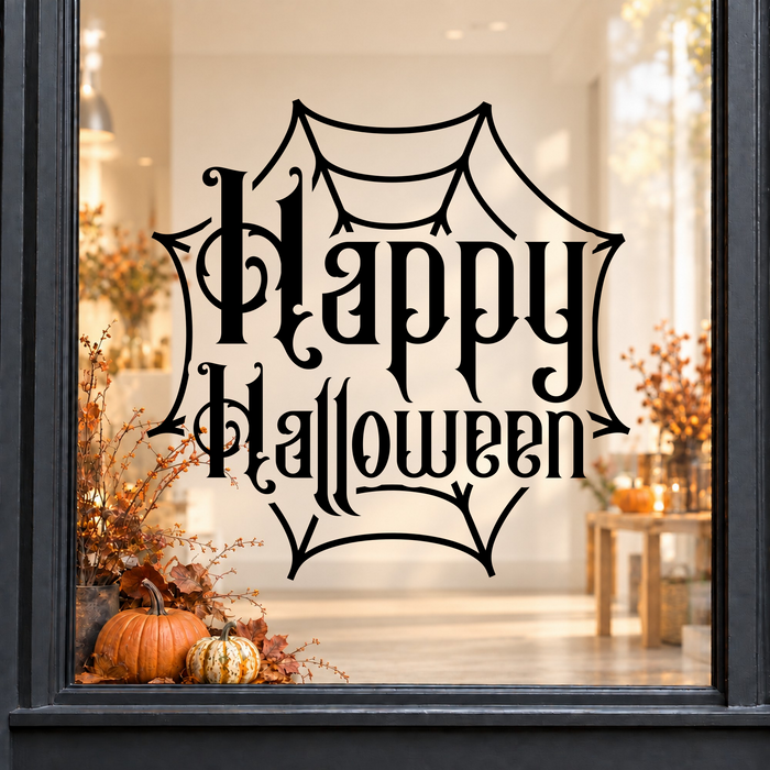 Ornate Happy Halloween Cobweb window sticker showing ornate Happy Halloween lettering framed by a cobweb, black vinyl on a light shop window with a dark charcoal frame