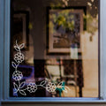 Floral Vine Corner Window Sticker for Shops & Homes displayed on a shop window
