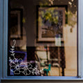 Flower & Leaf Corner Window Sticker for Shops & Homes displayed on a shop window