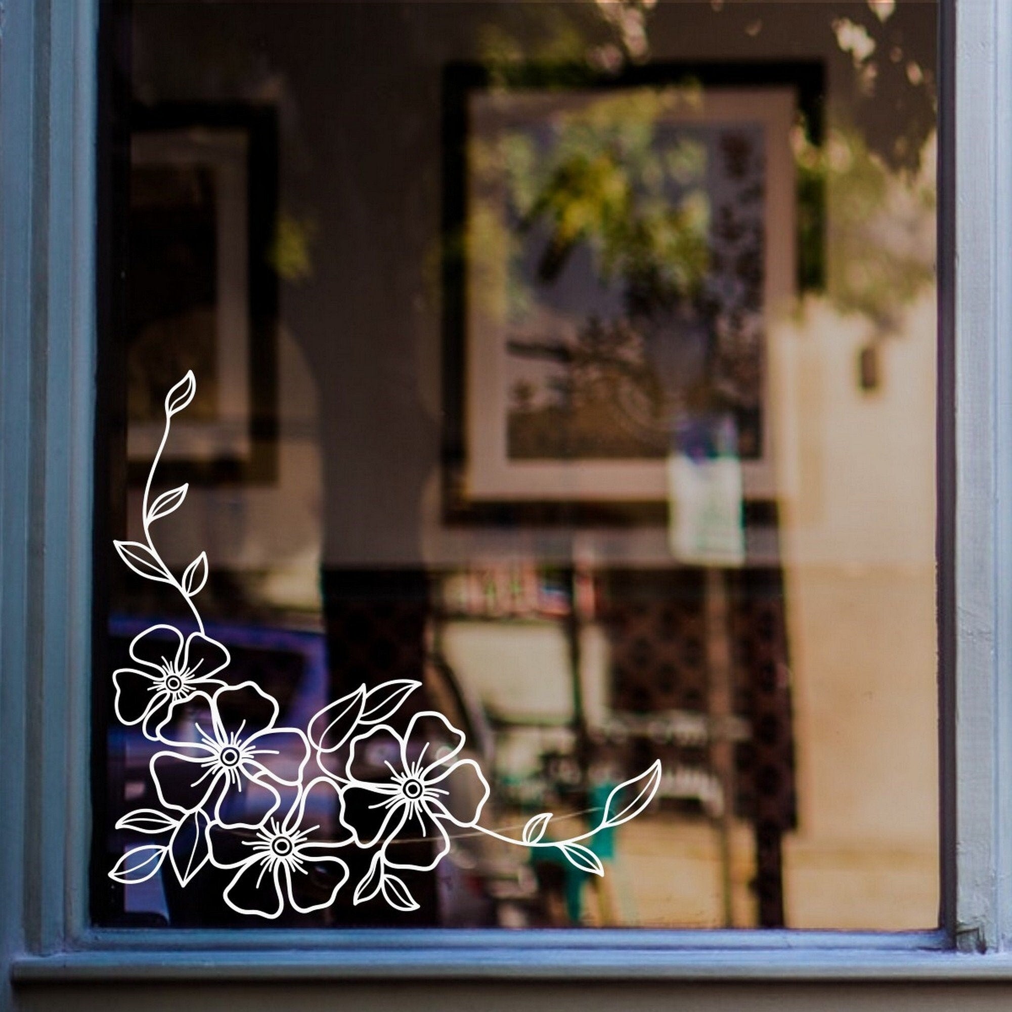 Floral Blossom Corner Window Sticker for Shops & Homes displayed on a shop window