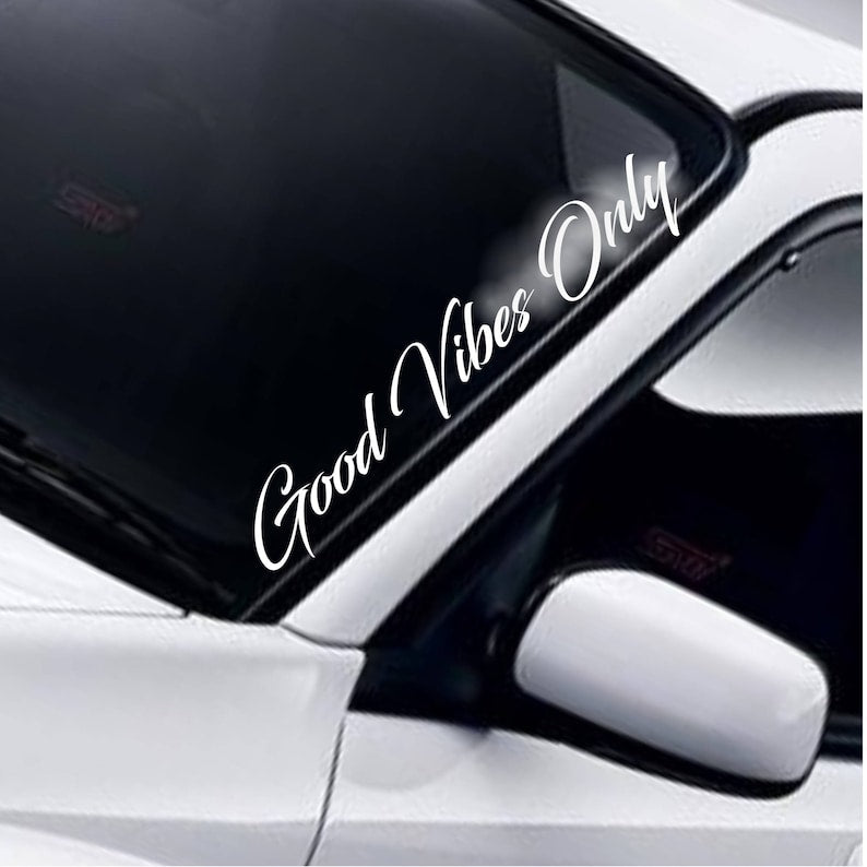 Good Vibes Only white vinyl windscreen sticker fitted to a car