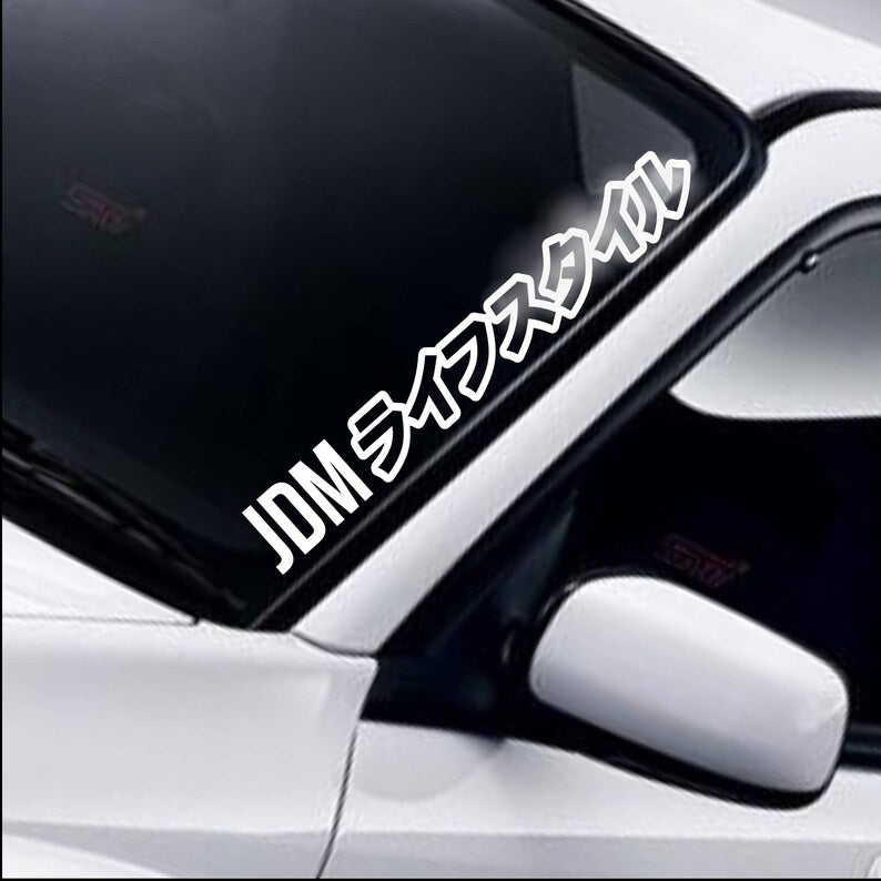 JDM Lifestyle Kanji white vinyl windscreen sticker fitted to a car