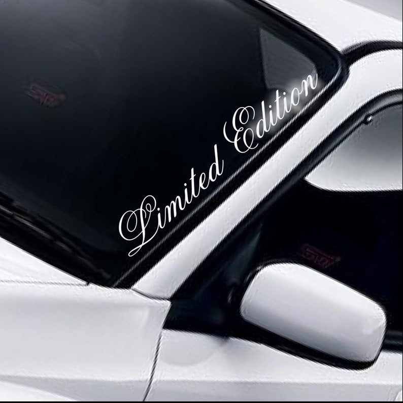 Limited Edition script white vinyl windscreen sticker fitted to a car