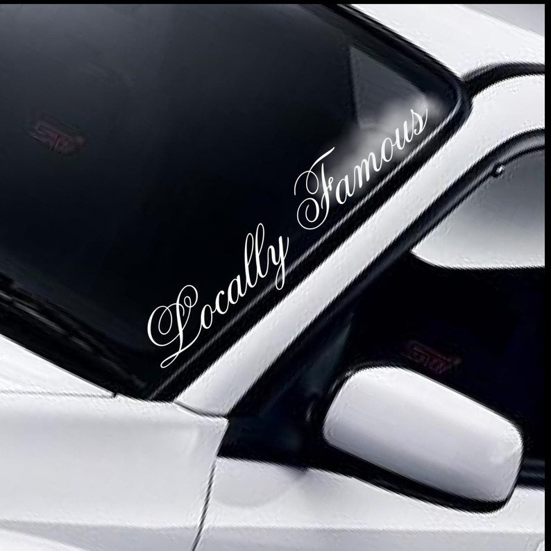 Locally Famous script white vinyl windscreen sticker fitted to a car