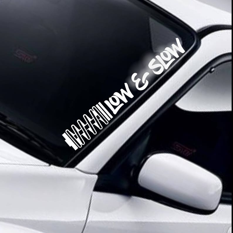 Low and Slow coil windscreen sticker fitted to a car windscreen