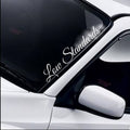 Low Standards script windscreen sticker fitted to a car windscreen