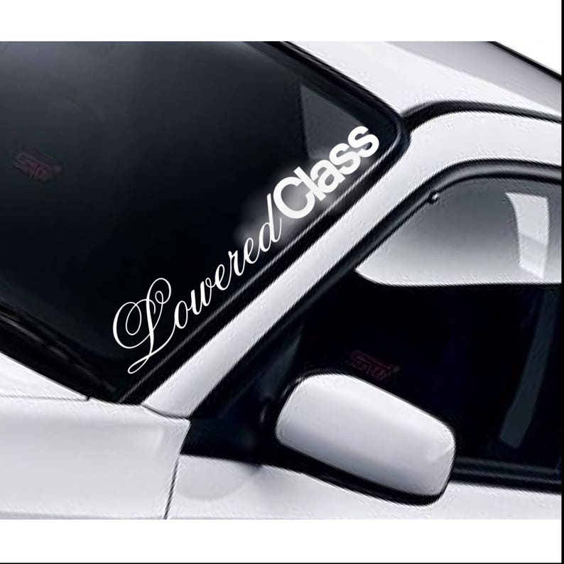 Lowered Class script windscreen sticker fitted to a car windscreen
