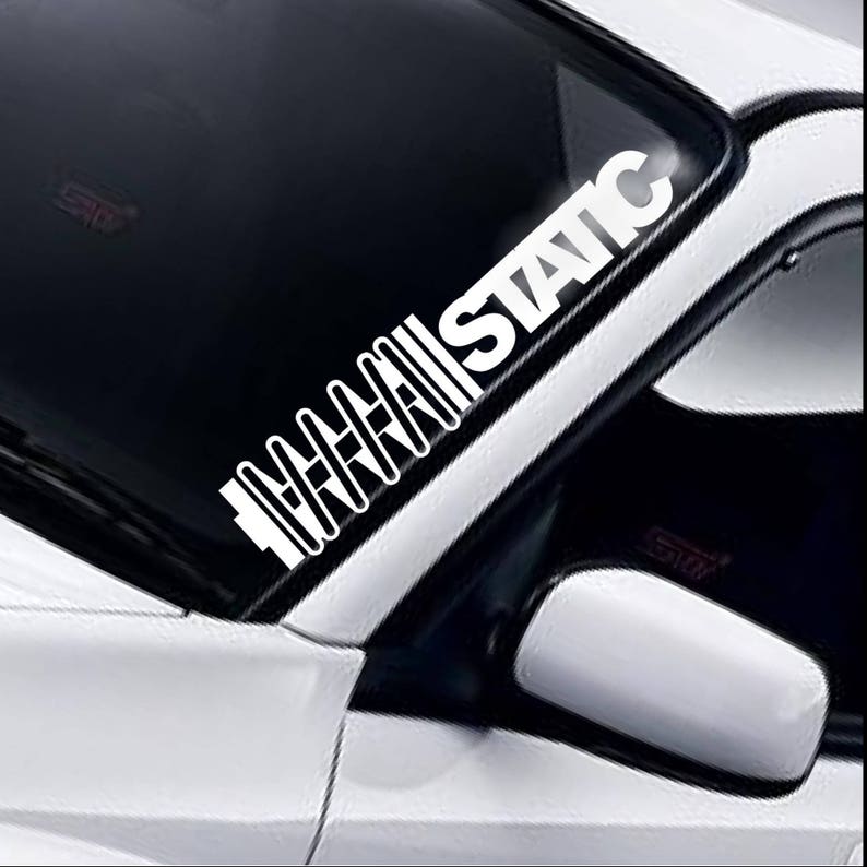 Static coil windscreen sticker fitted to a car windscreen