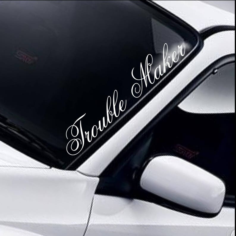 Trouble Maker script windscreen sticker fitted to a car windscreen
