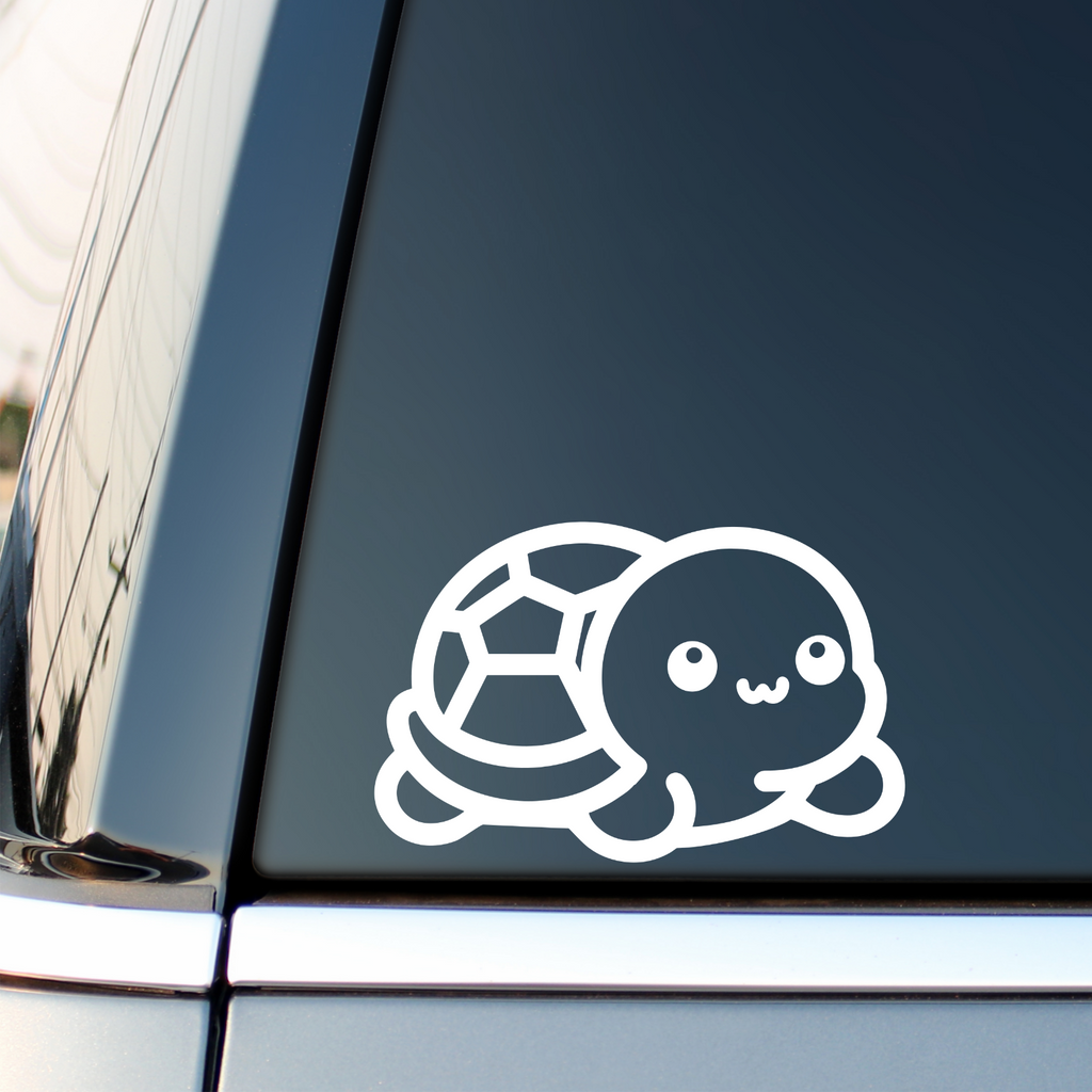 White baby turtle decal on a vehicle side window.