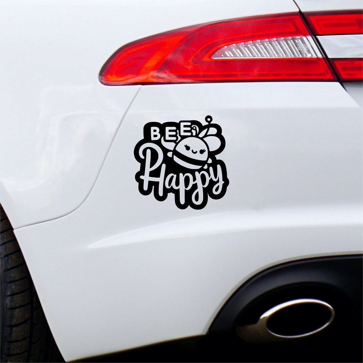 Black Bee Happy bold lettering sticker on a white car bumper.