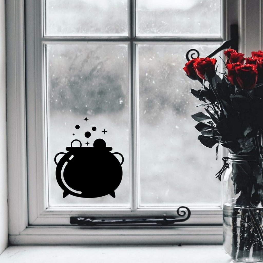 Cauldron Halloween window sticker displayed on a window