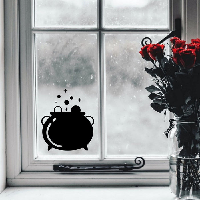 Cauldron Halloween window sticker displayed on a window